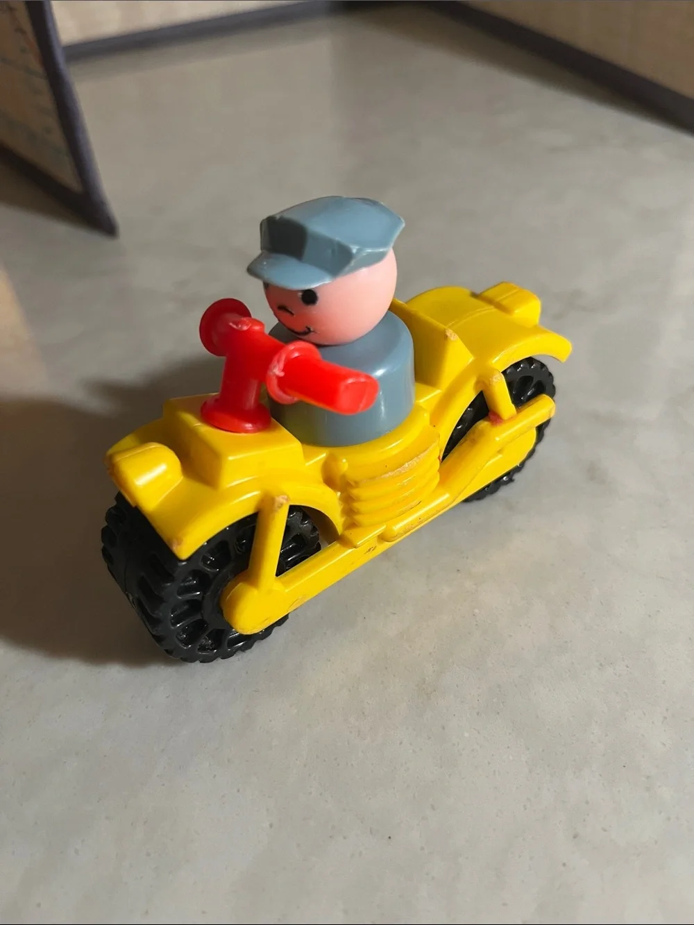 Vintage Fisher Price motorcycle with policeman